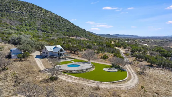 a view of balcony with couches and a potted plant
