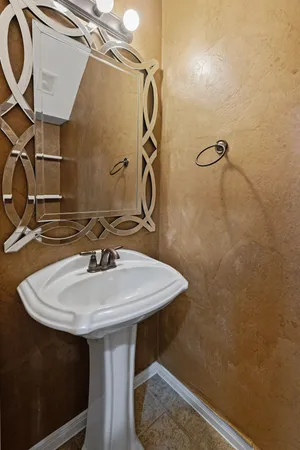 a bathroom with a sink a mirror and a shower