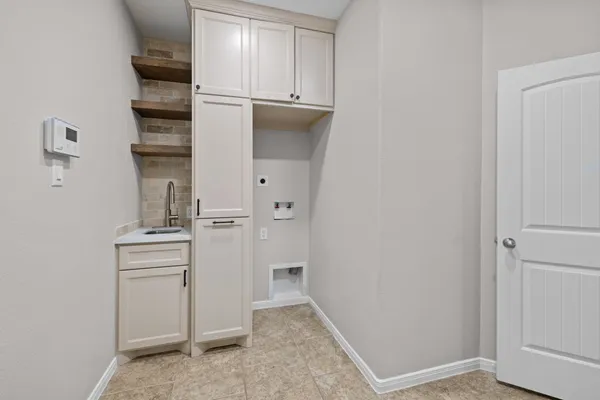 a view of kitchen and utility room
