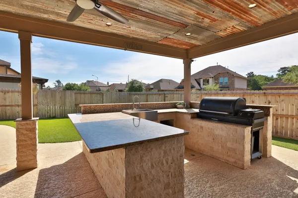 a view of a patio with a table chairs and a patio