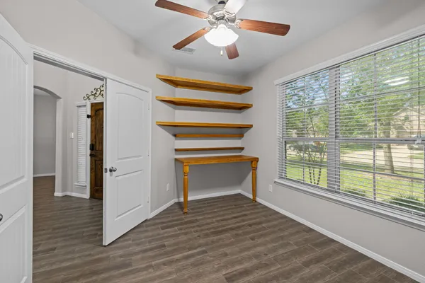 a view of room window and wooden floor