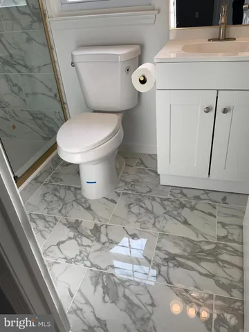 a bathroom with a toilet and a sink