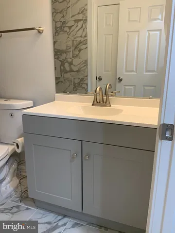 a bathroom with a sink and a toilet