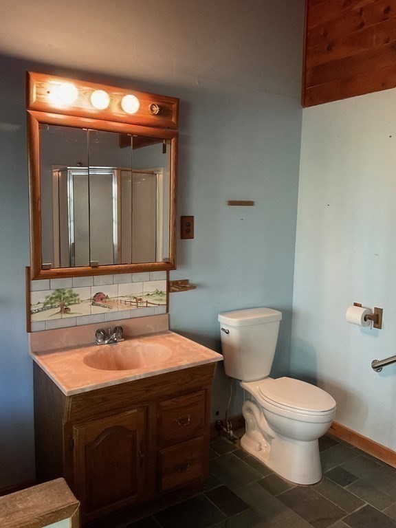 57 East Colrain Road Colrain, MA 01340 - Photo 16 of 31 a bathroom with a toilet sink and mirror