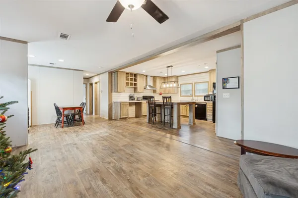 a view of kitchen with furniture and wooden floor