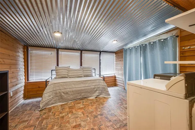 a view of a patio with table and chairs