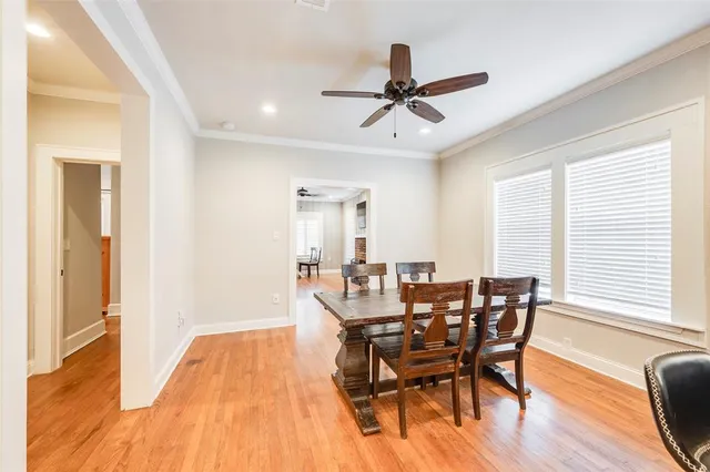 a view of a dining room with furniture and window