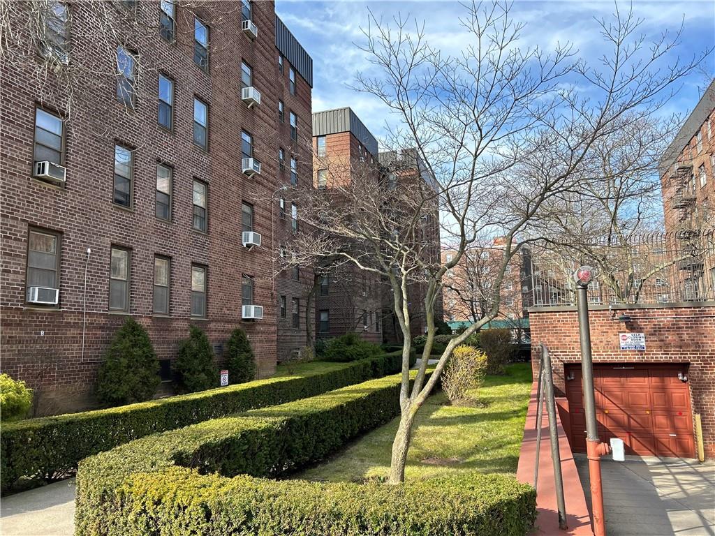 2232 Brigham Street, Unit 2K Brooklyn, NY 11229 - Photo 14 of 14 a front view of a house with a yard
