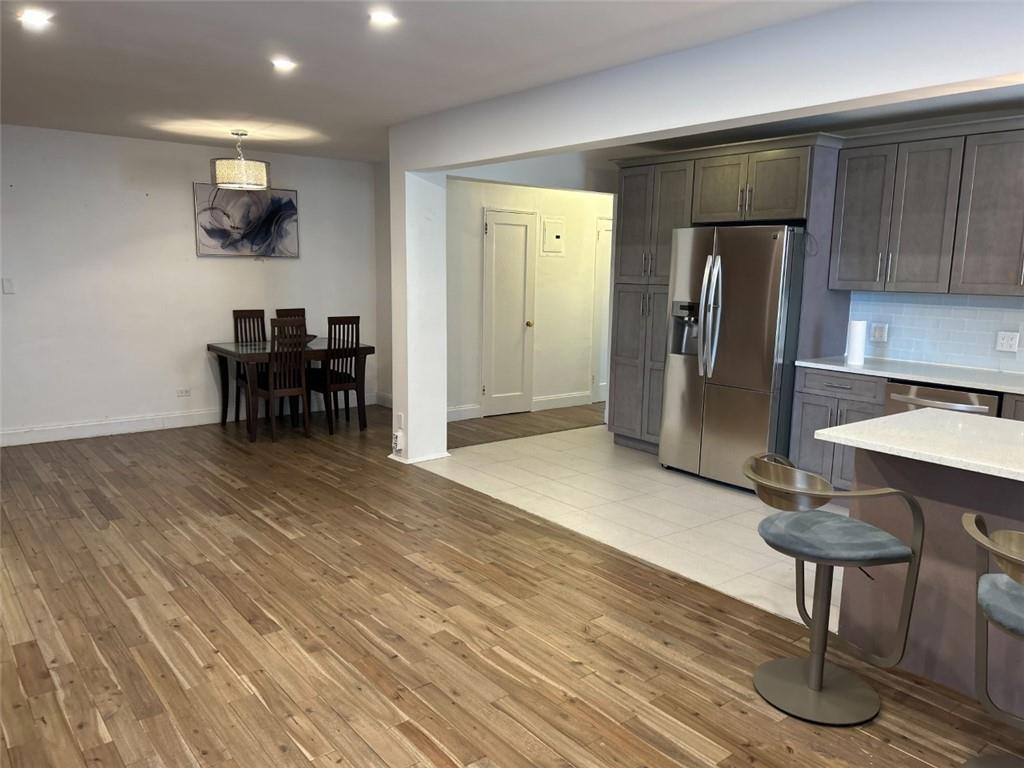 2232 Brigham Street, Unit 2K Brooklyn, NY 11229 - Photo 2 of 14 a view of kitchen with furniture and a refrigerator