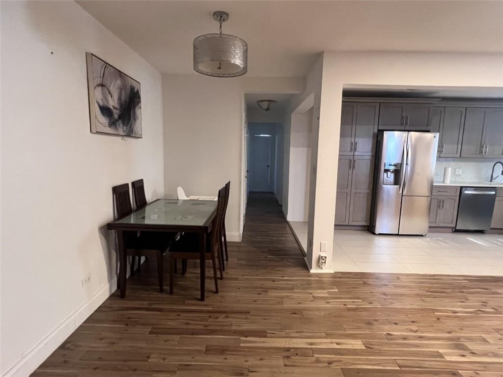 2232 Brigham Street, Unit 2K Brooklyn, NY 11229 - Photo 3 of 14 a view of a dining room with furniture and wooden floor