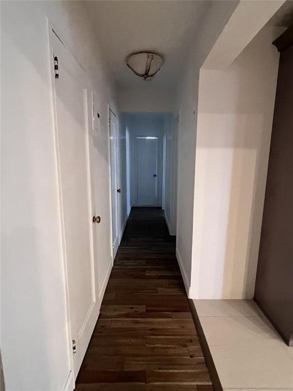 2232 Brigham Street, Unit 2K Brooklyn, NY 11229 - Photo 6 of 14 a view of a hallway with wooden floor and entryway