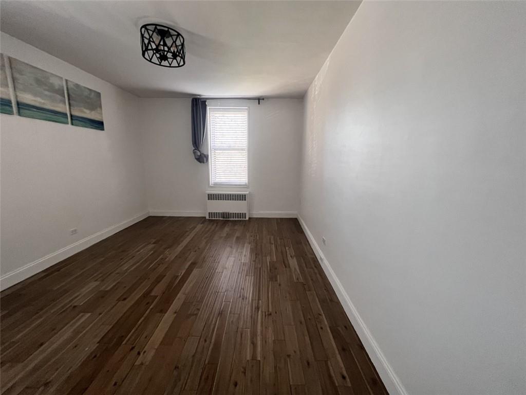 2232 Brigham Street, Unit 2K Brooklyn, NY 11229 - Photo 8 of 14 a view of a room with wooden floor and window