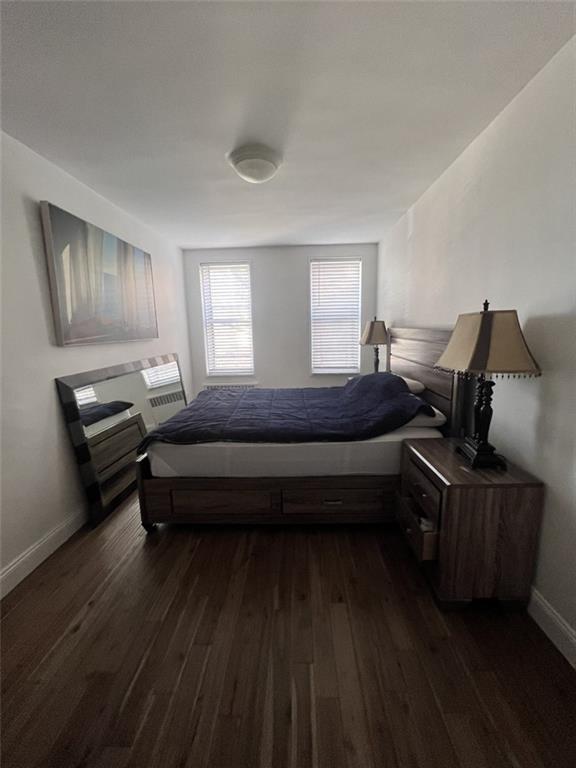 2232 Brigham Street, Unit 2K Brooklyn, NY 11229 - Photo 10 of 14 a bedroom with a bed wooden floor and window