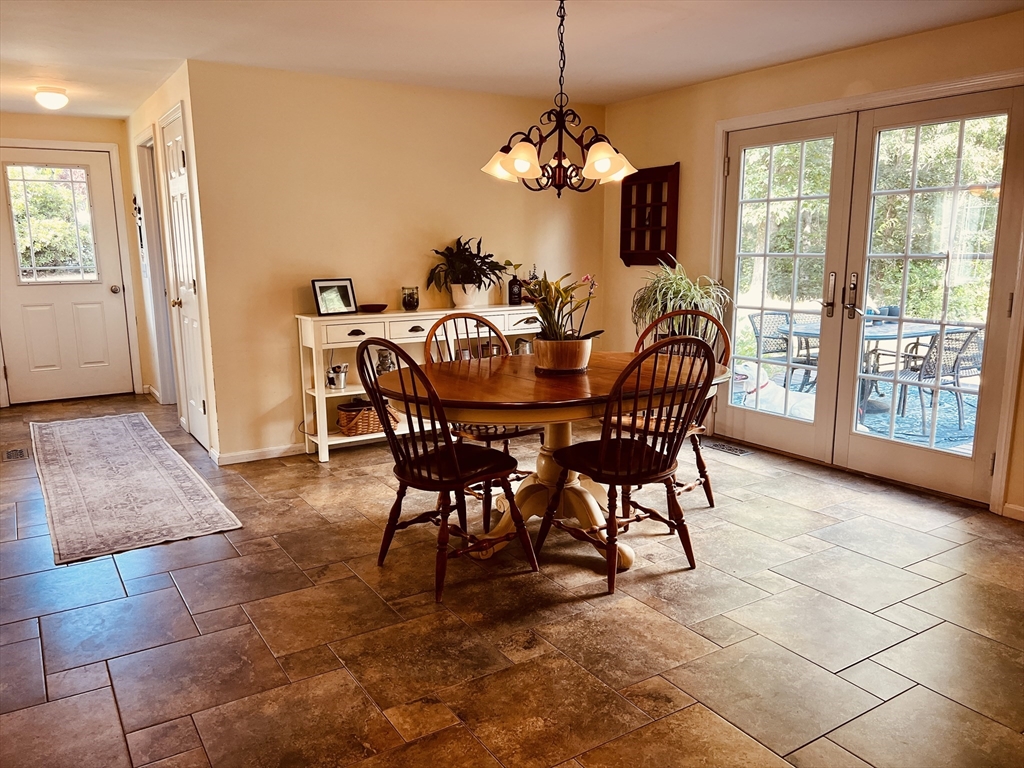 97 Breakneck Road Sturbridge, MA 01566 - Photo 13 of 33 a view of a dining room with furniture wooden floor and chandelier