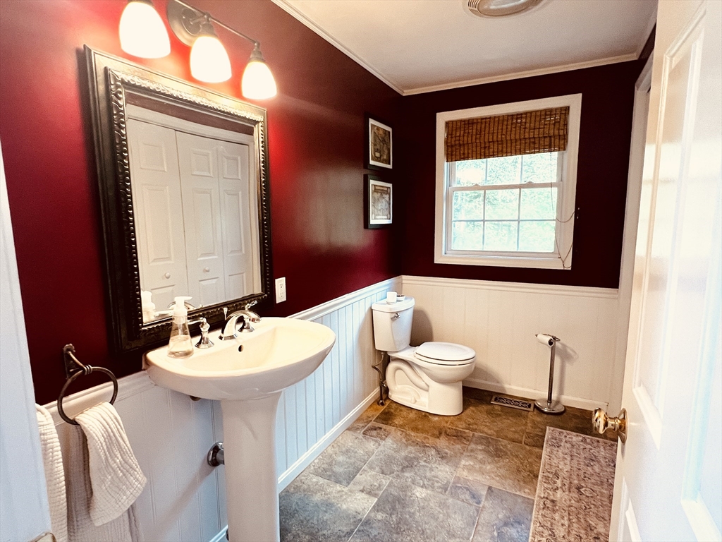 97 Breakneck Road Sturbridge, MA 01566 - Photo 16 of 33 a bathroom with a toilet sink and mirror