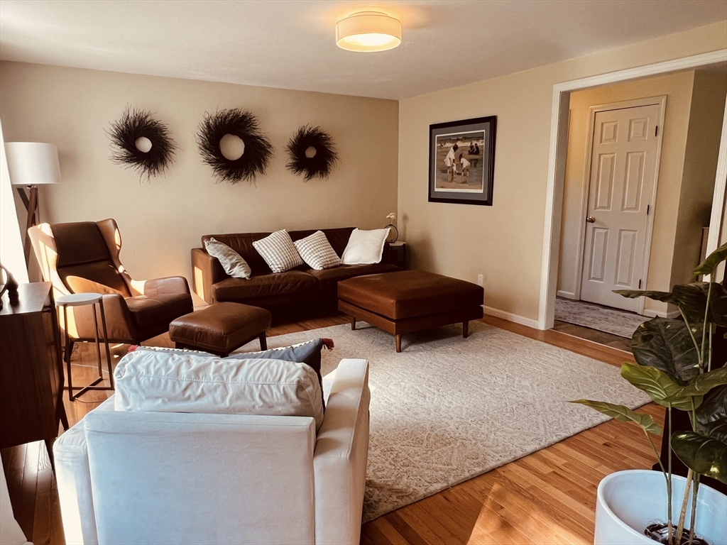 97 Breakneck Road Sturbridge, MA 01566 - Photo 4 of 33 a living room with furniture and painting on the wall