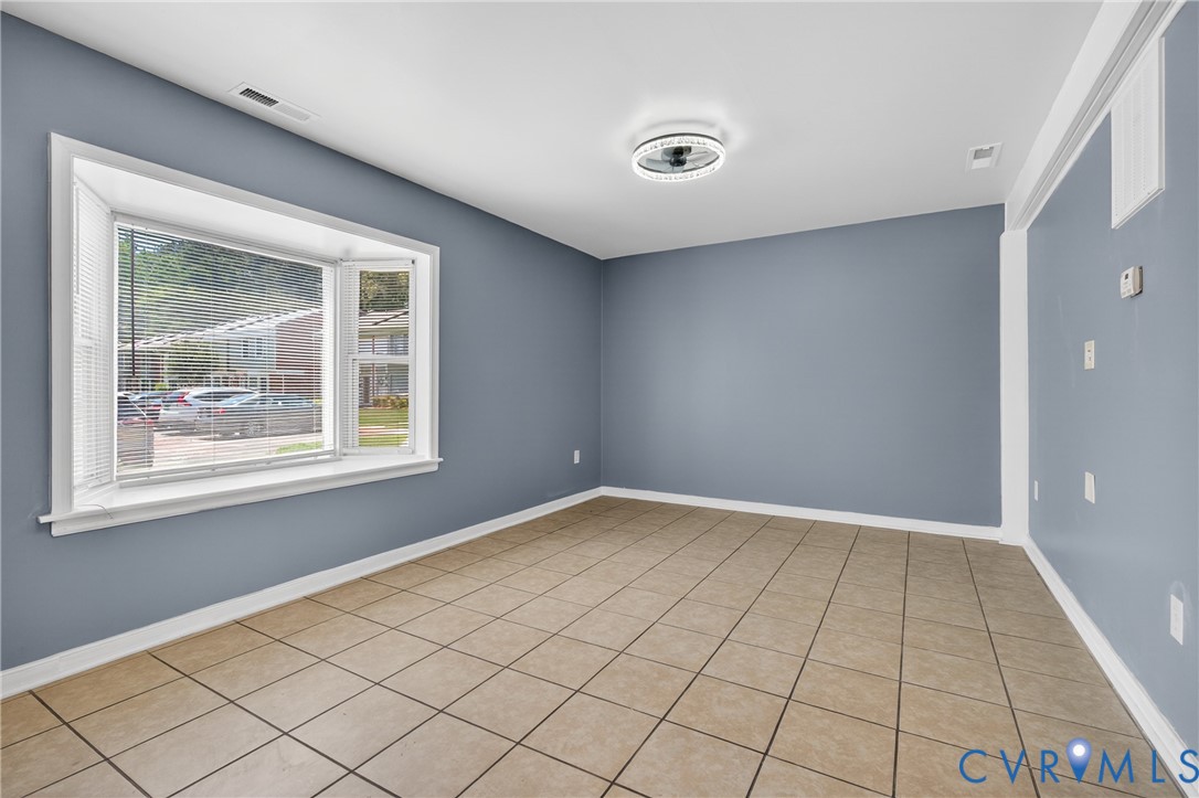 10050 Purcell Road Richmond, VA 23228 - Photo 4 of 26 an empty room with windows