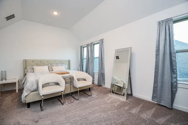 a view of a house with backyard sitting area and garden