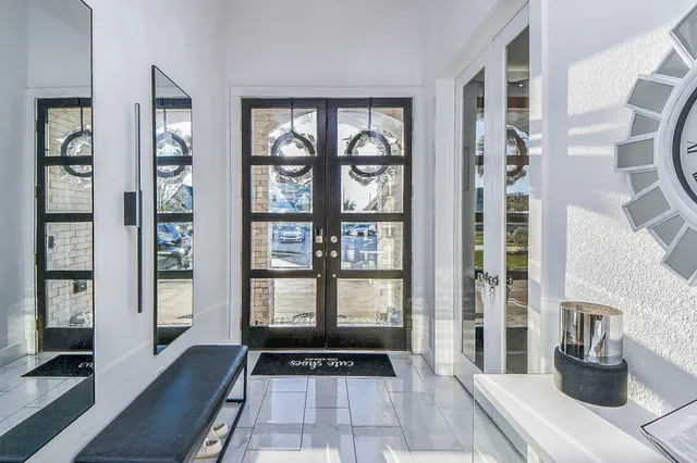 a view of a walk in closet and a living room