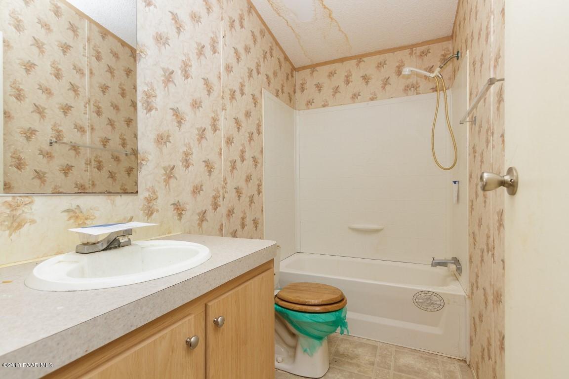 25375 North Stump Road Paulden, AZ 86334 - Photo 14 of 25 a bathroom with a sink a toilet and shower