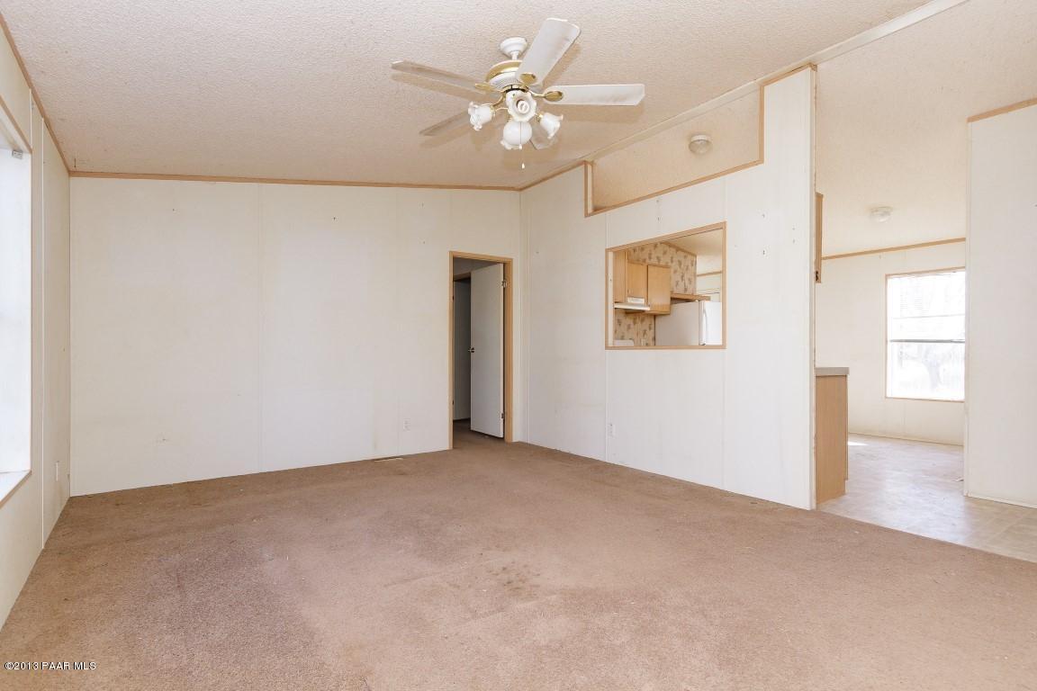 25375 North Stump Road Paulden, AZ 86334 - Photo 3 of 25 an empty room with windows and fan