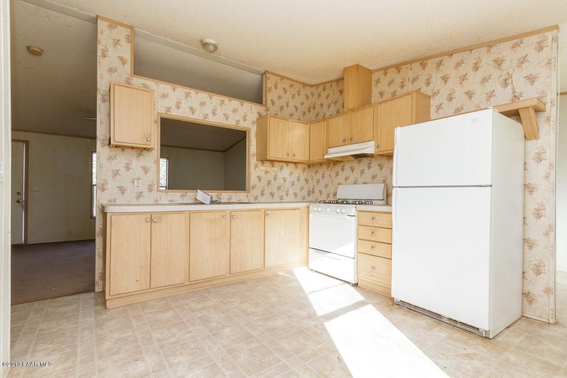 25375 North Stump Road Paulden, AZ 86334 - Photo 6 of 25 a bathroom with a granite countertop sink and a mirror