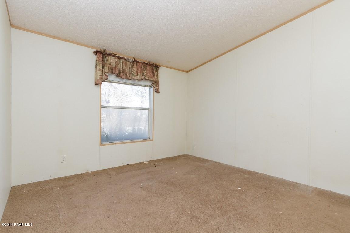 25375 North Stump Road Paulden, AZ 86334 - Photo 7 of 25 an empty room with a window