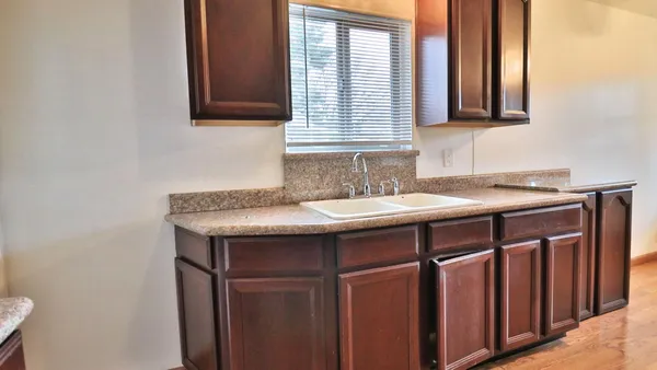 a sink sitting next to a bathroom sink