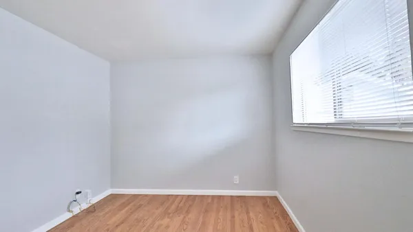 a view of a room that has a window