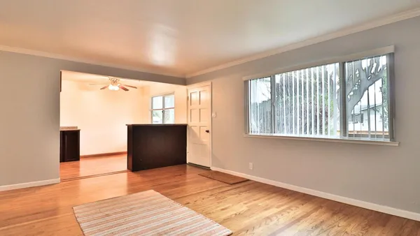 a view of an empty room with a window