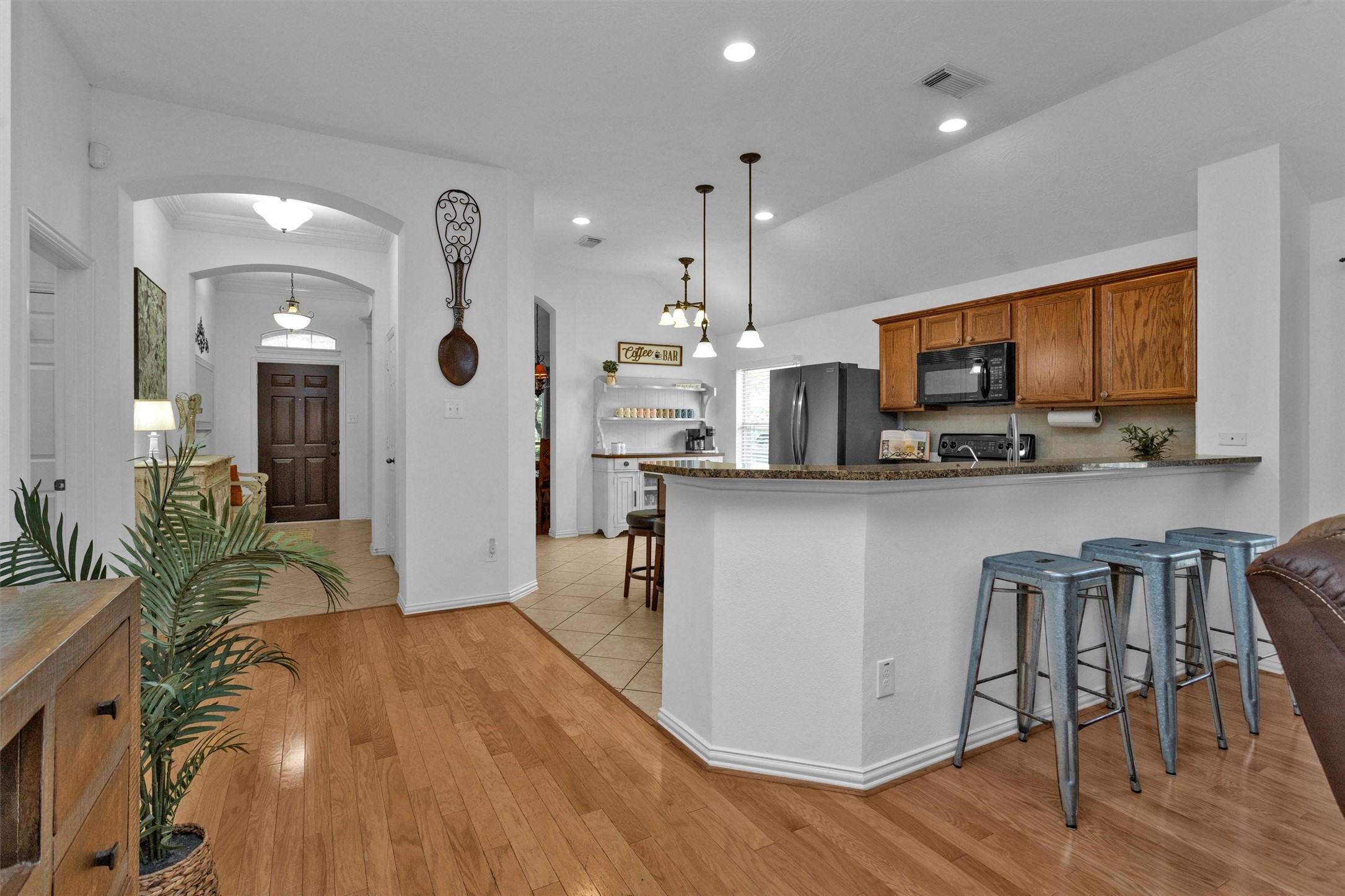12310 West Elizabeth Shore Loop Cypress, TX 77433 - Photo 12 of 42 Breakfast bar separates kitchen and living room