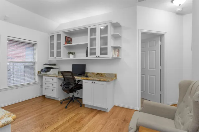 a bathroom with a sink toilet and mirror