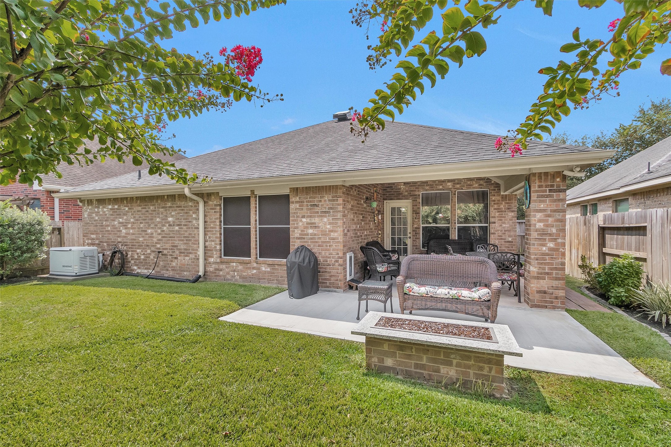 12310 West Elizabeth Shore Loop Cypress, TX 77433 - Photo 32 of 42 Back patio extended out towards a gas fire pit