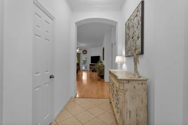 a bathroom with a sink a light fixture and a mirror