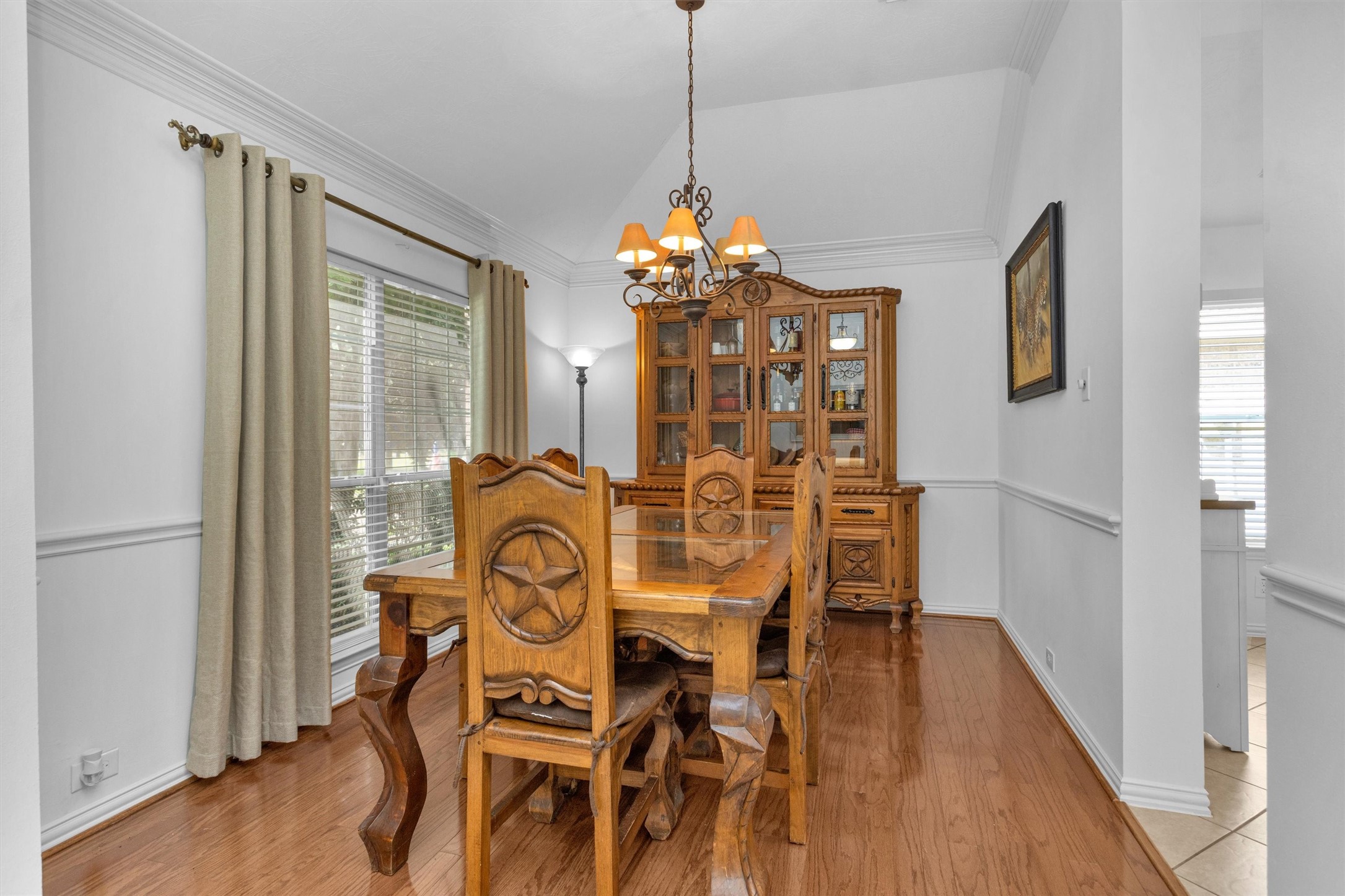 12310 West Elizabeth Shore Loop Cypress, TX 77433 - Photo 8 of 42 Elegant dining with chair rails and chandelier
