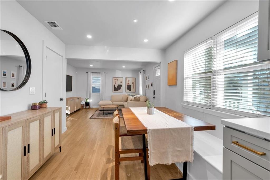 1520 Foote Street Northeast Atlanta, GA 30307 - Photo 12 of 39 a living room with furniture a large window and wooden floor