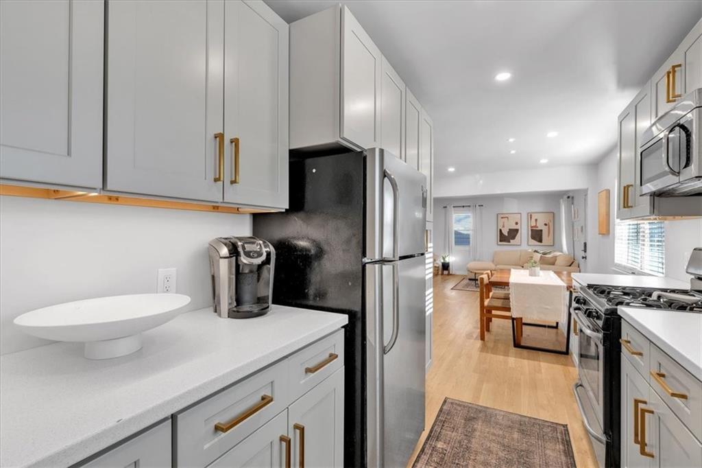 1520 Foote Street Northeast Atlanta, GA 30307 - Photo 15 of 39 a kitchen with a refrigerator and a sink