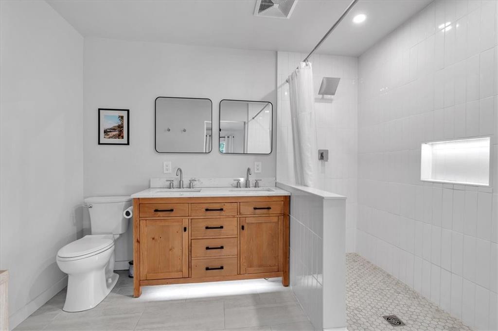 1520 Foote Street Northeast Atlanta, GA 30307 - Photo 20 of 39 a bathroom with a toilet sink and mirror