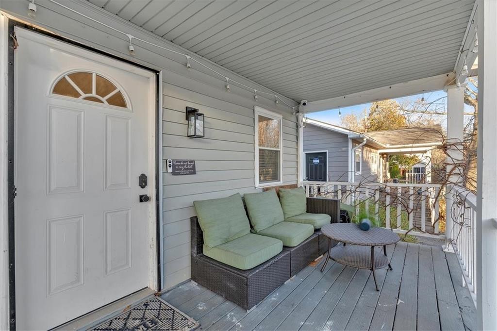 1520 Foote Street Northeast Atlanta, GA 30307 - Photo 2 of 39 a view of a patio with a couch and wooden floor