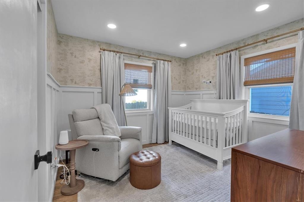 1520 Foote Street Northeast Atlanta, GA 30307 - Photo 25 of 39 a bedroom with a bed and a chandelier