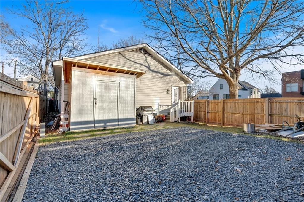 1520 Foote Street Northeast Atlanta, GA 30307 - Photo 30 of 39 a view of a house with a backyard and trees
