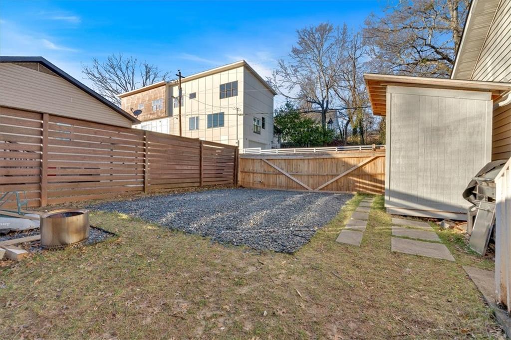 1520 Foote Street Northeast Atlanta, GA 30307 - Photo 31 of 39 a view of a backyard with a chair and floor to ceiling window