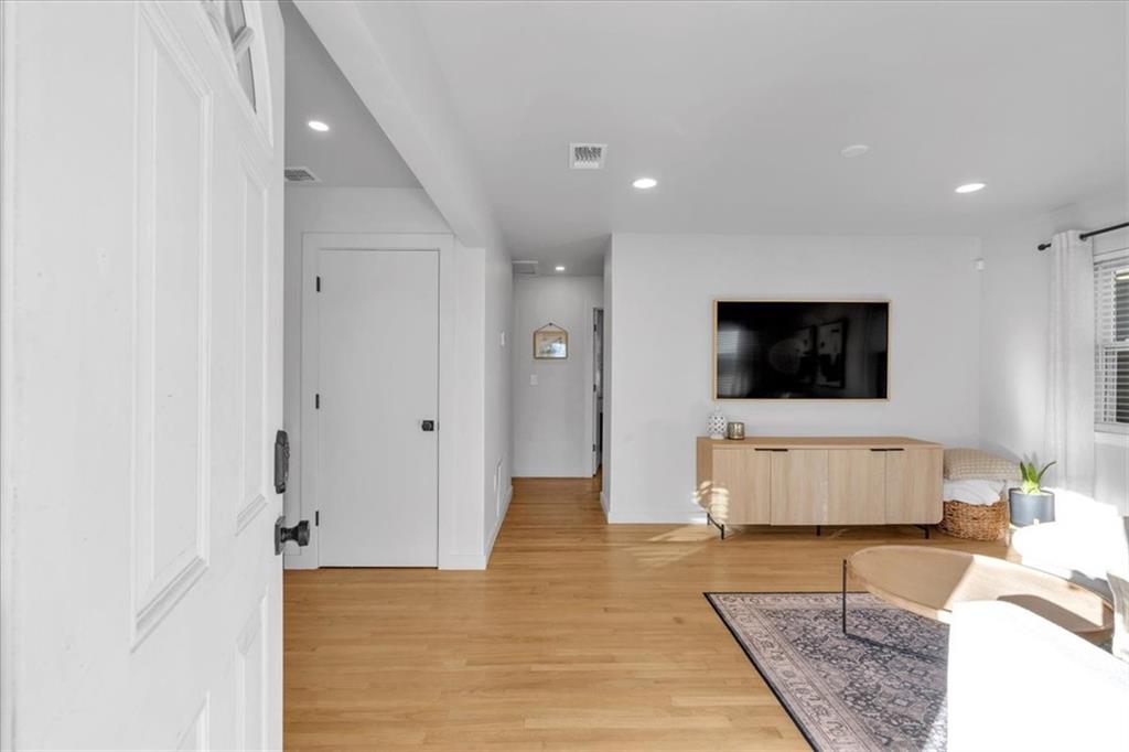 1520 Foote Street Northeast Atlanta, GA 30307 - Photo 4 of 39 a living room with furniture and a flat screen tv