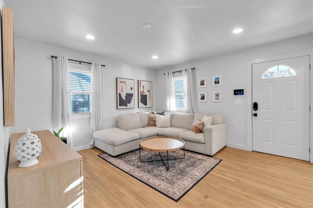 1520 Foote Street Northeast Atlanta, GA 30307 - Photo 6 of 39 a living room with furniture and a rug