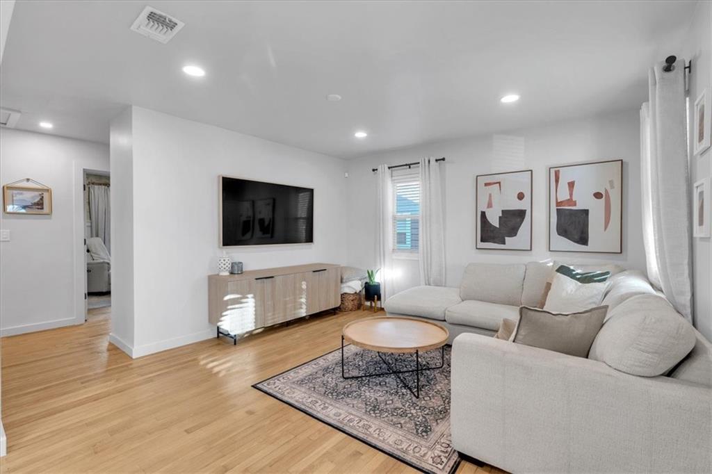 1520 Foote Street Northeast Atlanta, GA 30307 - Photo 8 of 39 a living room with furniture and a flat screen tv