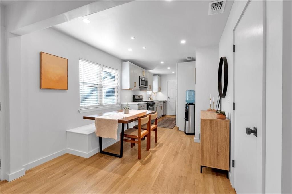 1520 Foote Street Northeast Atlanta, GA 30307 - Photo 10 of 39 a kitchen with stainless steel appliances granite countertop a refrigerator and a stove top oven