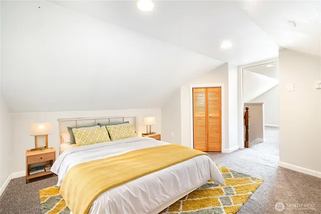 a bedroom with a bed and a mirror