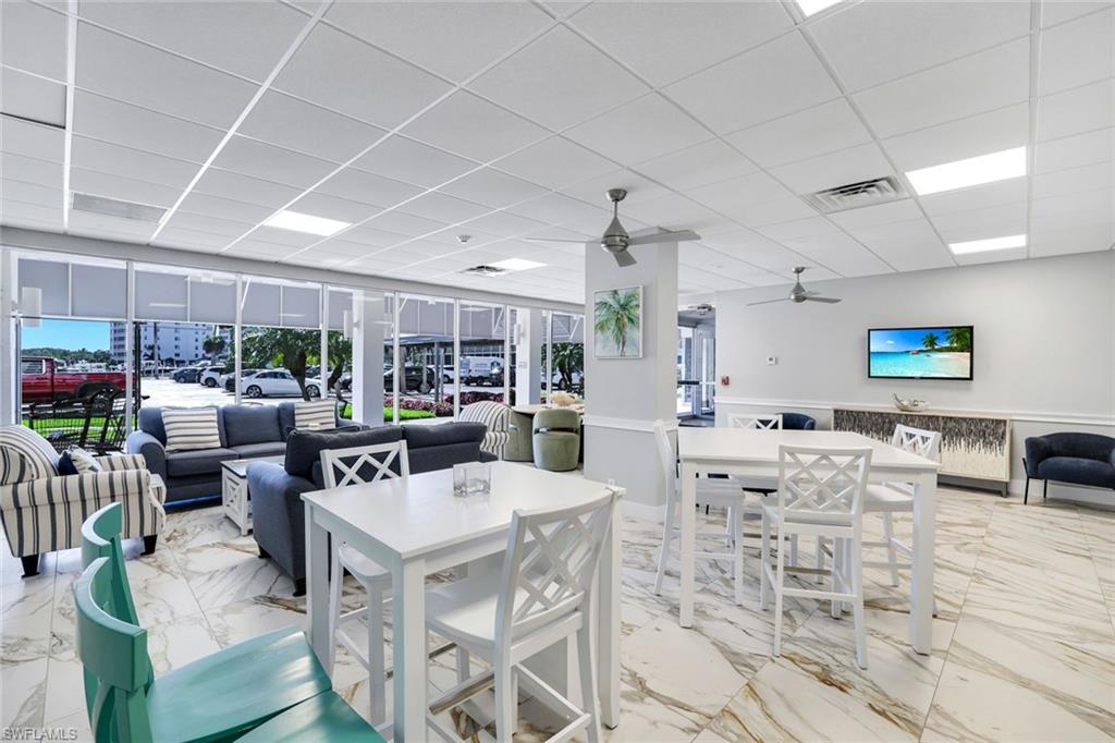 5 Bluebill Avenue, Unit 506 Naples, FL 34108 - Photo 18 of 25 a view of a dining room with furniture window and outside view