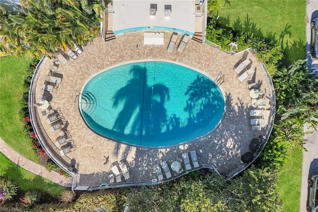 5 Bluebill Avenue, Unit 506 Naples, FL 34108 - Photo 19 of 25 an aerial view of a house with outdoor space and trees all around