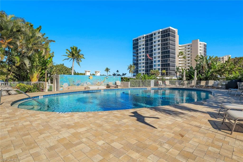 5 Bluebill Avenue, Unit 506 Naples, FL 34108 - Photo 20 of 25 a view of swimming pool and a yard